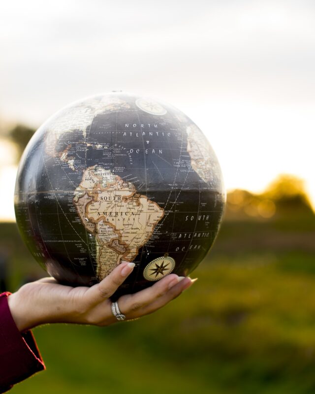 closeup-shot-female-holding-globe